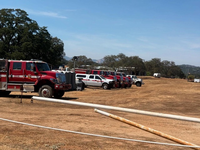 Cal-Fire engines and crew vehicles staging at the Frogtown site during the 2025 wildfire response