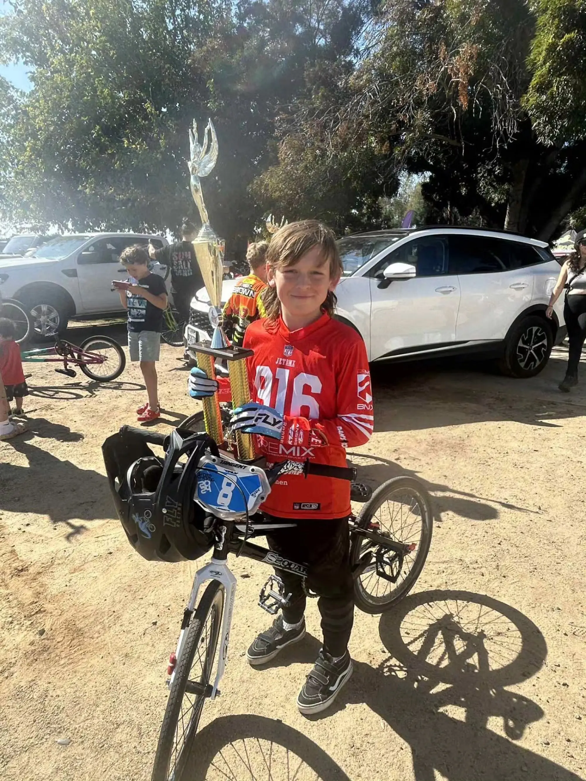 2025 California Cup Grand Prix Finals — wall of trophies on the Airtime BMX track at sunrise